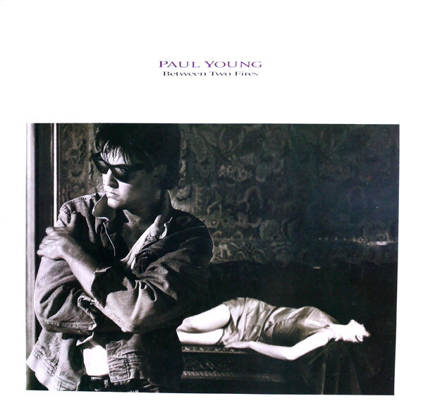 Paul Young - Between Two Fires - Near Mint (NM or M-) - Vinyl