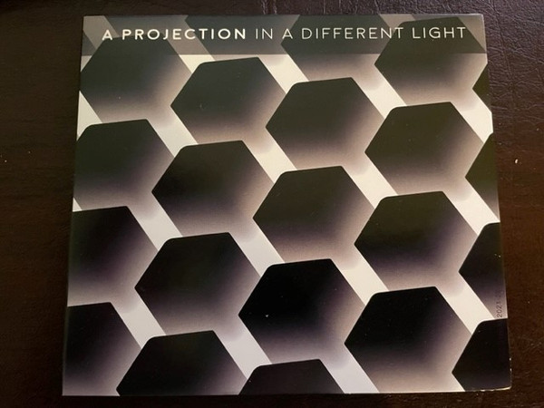 A Projection - In A Different Light - Mint (M) - CD