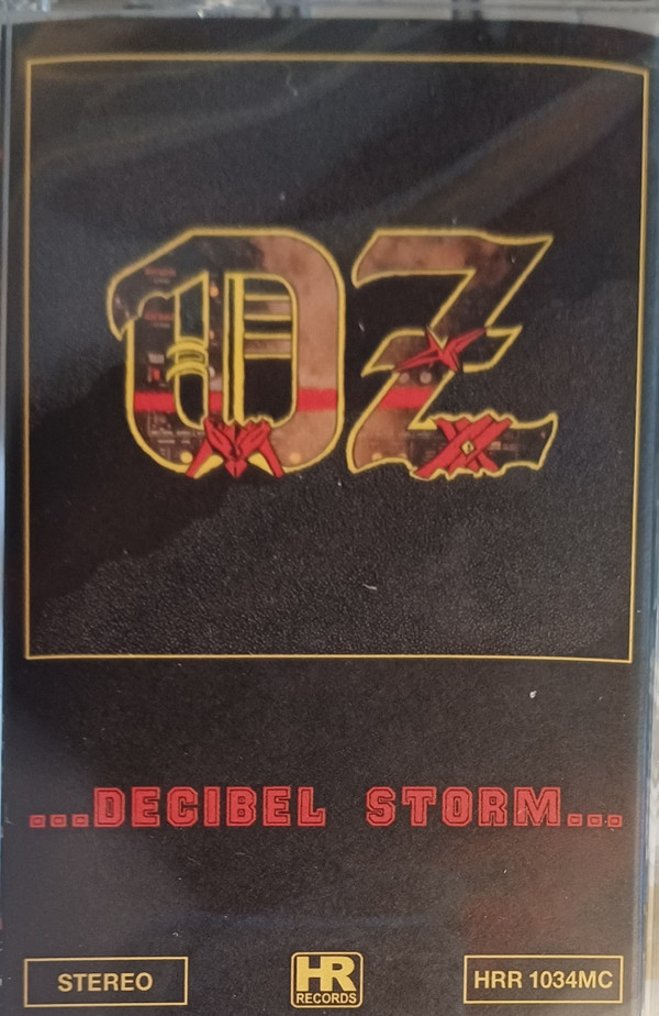 OZ (15) - Decibel Storm - Mint (M) - Cassette
